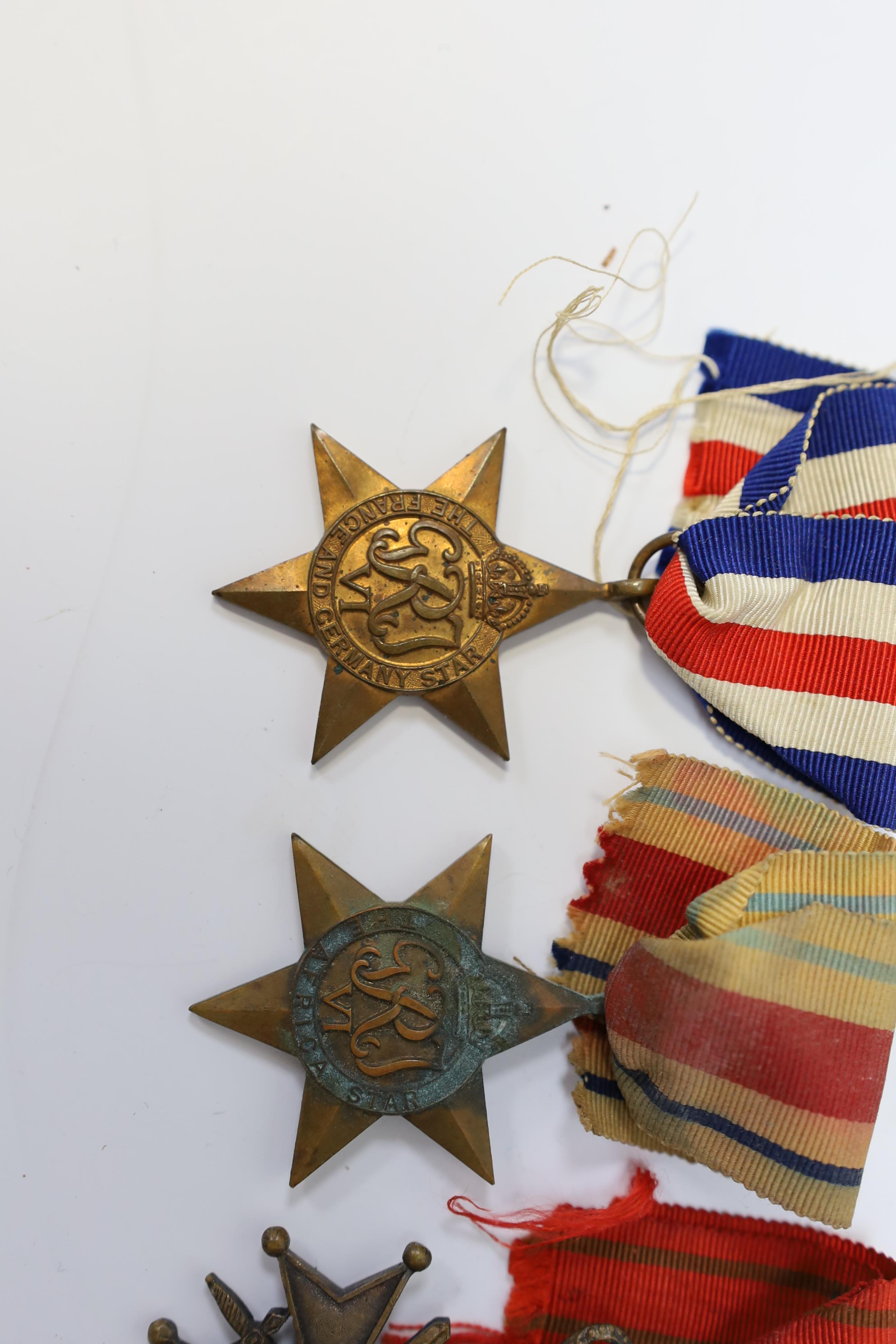 Seven medals including; a First World War British War Medal awarded to PTE. H. Lee DURH. L.I., A 1939-1945 medal, The Defence Medal, the Africa Star, the France and Germany Star, the 1939-1945 Star, plus a GPO cap badge.